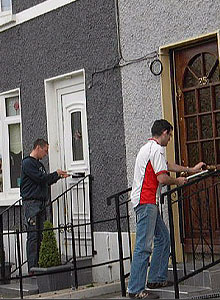 irg activists distribute poster-size copies of the 1916 Proclamation door-to-door