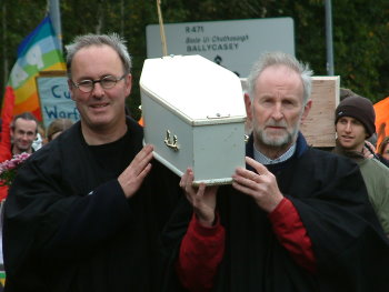 Small white coffin carried to symbolise chidren who have been killed