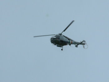 Helicopter hovers overhead