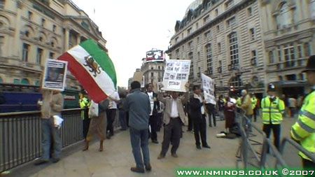 Iranian royalist waving Pahlavi flag