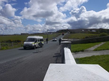 At Pullathomas graveyard, garda escort Shell's traffic on foot