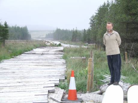 Der Holland surveys the proposed pipeline route.