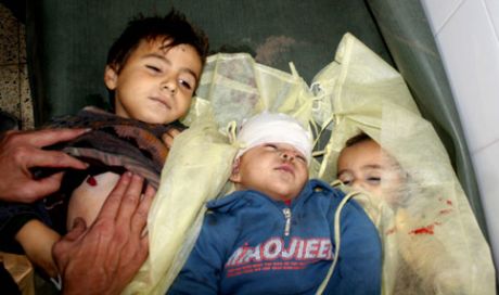 Children from the Samouni family lie in the morgue in the al-Zeitoun area of Gaza City. (Mohamed Al-Zanon/MaanImages)