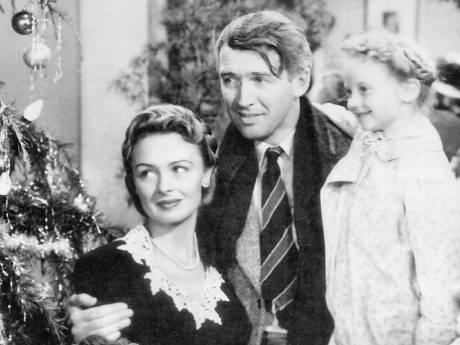 George Bailey (James Stewart), Mary Bailey (Donna Reed), and their youngest daughter Zuzu (Karolyn Grimes) in Its a Wonderful Life.
