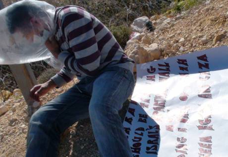 Iyad Burnat in distress after being tear gassed