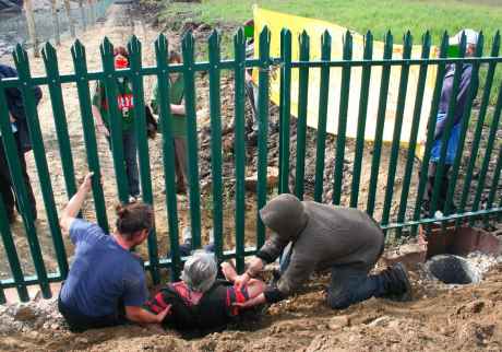 Getting under the fence into the inner, more secure area of the refinery site