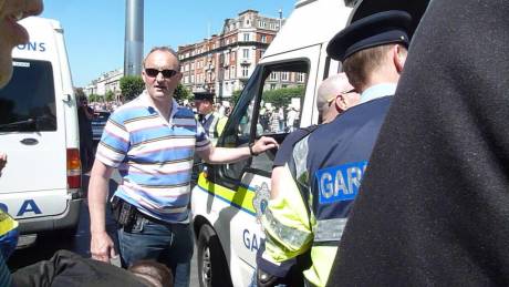 The guard from Store Street Garda Station who arrested me (with sunglasses). Does anybody know who he is?