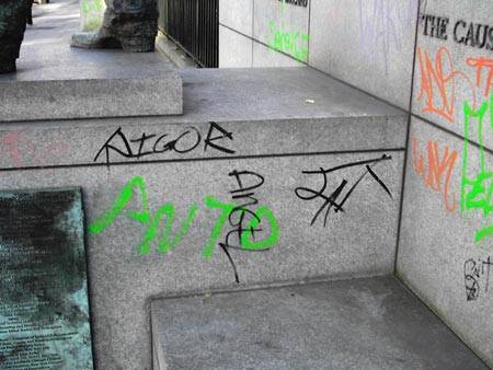 Tags at the statue base