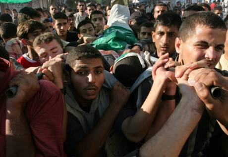 Click on image to see full-sized version Palestinians carry the body of 21-year-old Bassem al-Jammal during his funeral in Gaza City, 2 November 2006. Al-Jamal was a Hamas activist killed by Israeli forces. (MaanImages/Wesam Saleh)