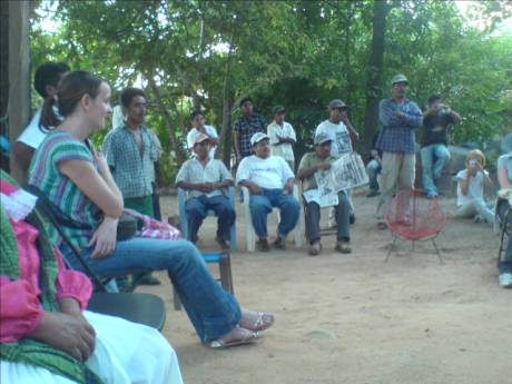 OPIM men at the meeting in their headquarters, Jane Jones from Tlachinollan in the foreground and two Peace Brigades accompaniers who are delegated to OPIM on the far right