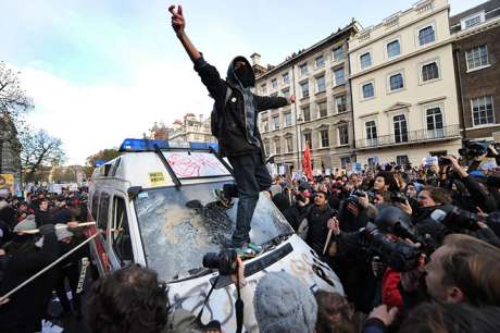 UK STUDENT PROTESTERS STILL ANGRY - police van SMASHED