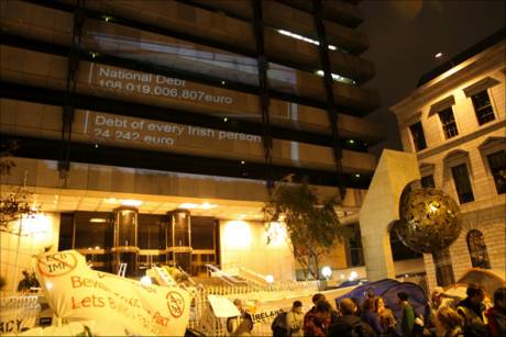 Tent Town @ Dame street + Irish debt figures projected onto Central Bank