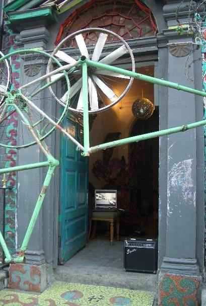 doors of the social centre open up, speakers on, computers hooked up, heads turning from the street