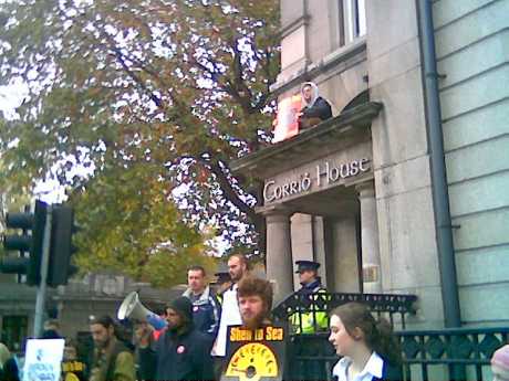 Protester scales the building