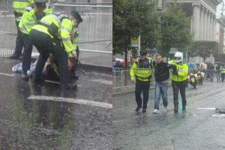 Garda arresting two protestors