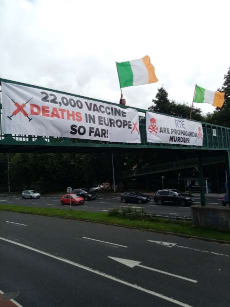 Banner for the 22k vax deaths in Europe so far outside Limerick vaccination center
